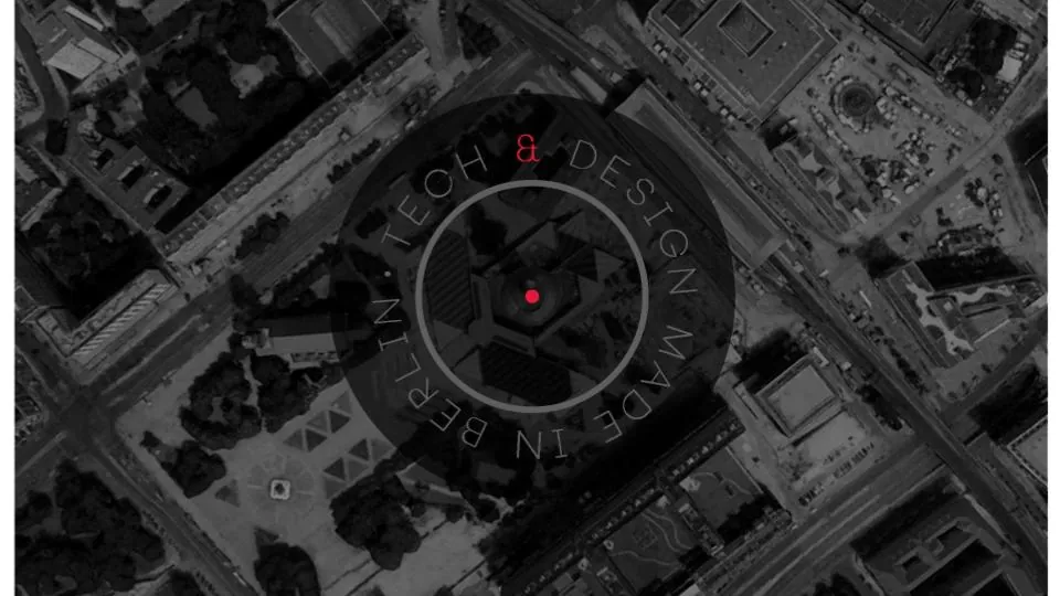 Aerial view of a city at night with the words Design made in Berlin
