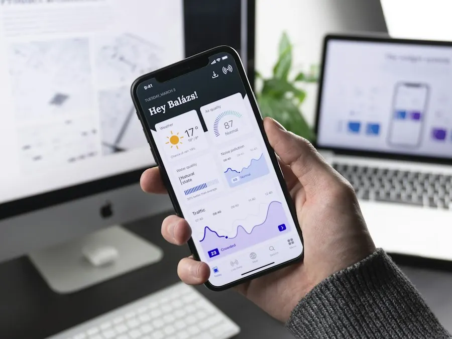 A hand holding a phone with a dashboard app