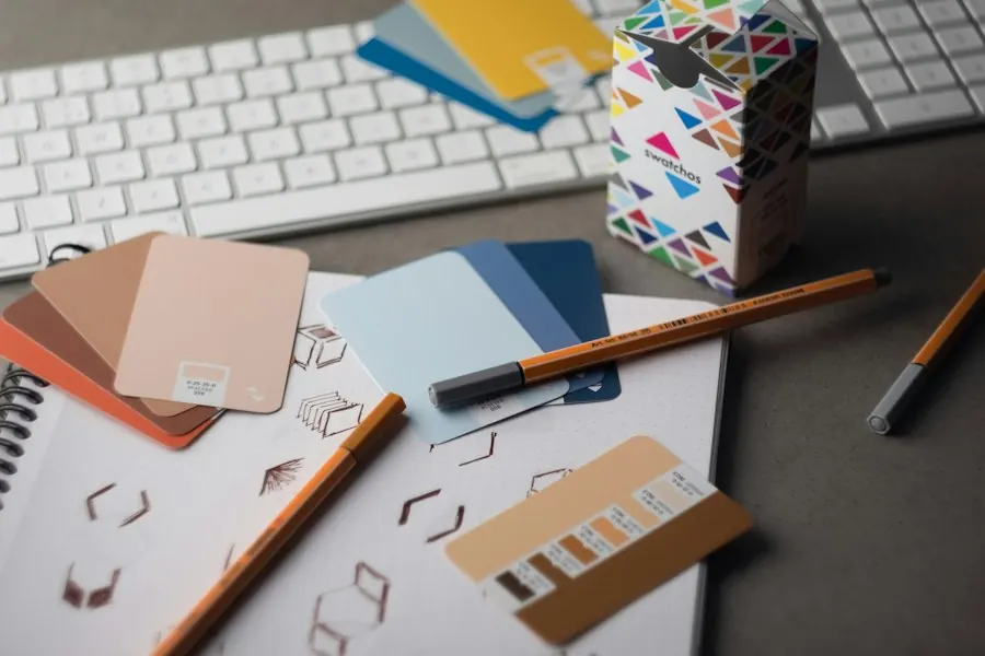 Colour swatches, pencils and brand sketches on a desk